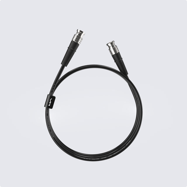 Matrix Audio Silver Copper Hi-Fi Clock Cable, Black, coiled three-quarter view on gray gradient