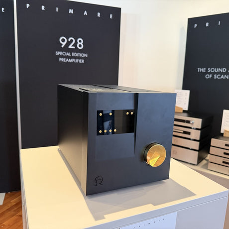 Primare 928 Special Edition Preamplifier on display at High End 2026, black with gold control knob, beside the 928 Special Edition signage