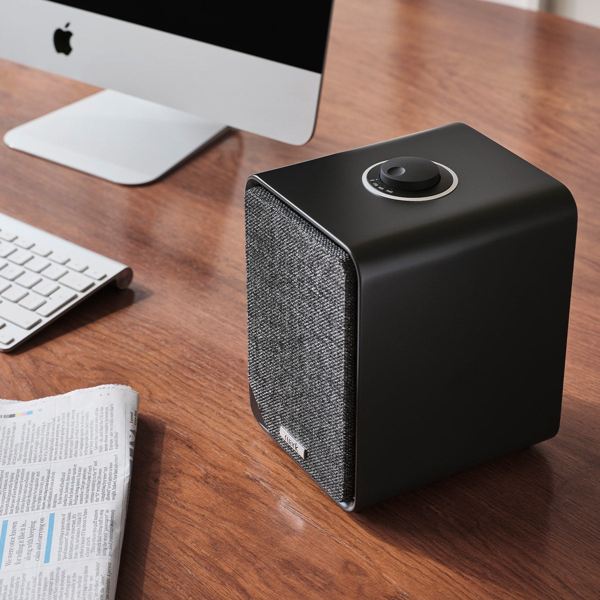 Ruark Audio MR1 MK3 Desktop Speaker System in Satin Charcoal, lifestyle on wooden desk with iMac