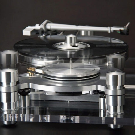 Oracle Audio Delphi MkVI turntable with new two-piece platter assembly visible above the bearing, dark studio background