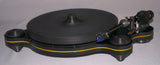Oracle Audio Origine Acrylic Insert, Matte Yellow, shown fitted in a black Origine Mk2 plinth, three-quarter view