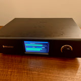 Perlisten DSPx Active Digital Crossover, Black, low three-quarter view from the right with touchscreen lit