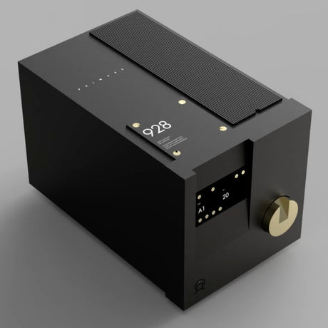 Primare 928 Special Edition Preamplifier in black, three-quarter view showing the gold volume control and display