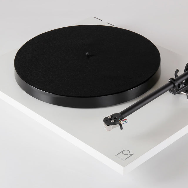 Rega Planar 1 Phenolic Resin Platter, Black, fitted to a matt white Planar 1 with felt mat, three-quarter view