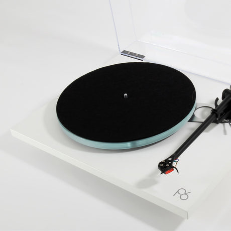 Rega Planar 6 Dual Layer Glass Platter, Clear, fitted to a matt white Planar 6 with felt mat, three-quarter view
