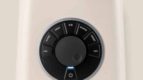 Ruark R1 MK4 RotoDial controller close-up showing source, menu, alarm, and preset controls