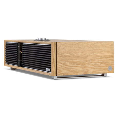 Ruark R410 Anniversary Edition All-in-One Music System, White Oak, three-quarter view facing right with the anniversary badge on the side panel