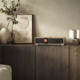 Ruark R410 Anniversary Edition All-in-One Music System, White Oak, in-room on a sideboard