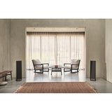 Ruark Audio Talisman-R Floorstanding Speakers, Satin Charcoal, front view with grilles fitted in a living room setting