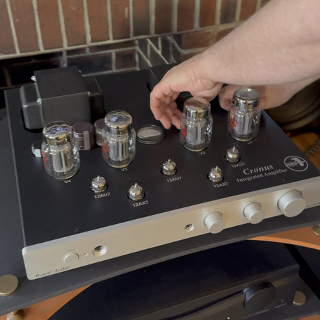 Mike checking the output tubes on a Rogue Audio Cronus Magnum integrated amplifier during a bias adjustment